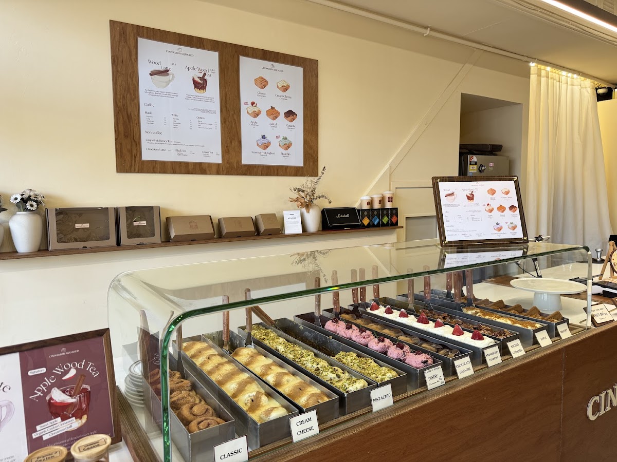 Display case lined with square cinnamon buns